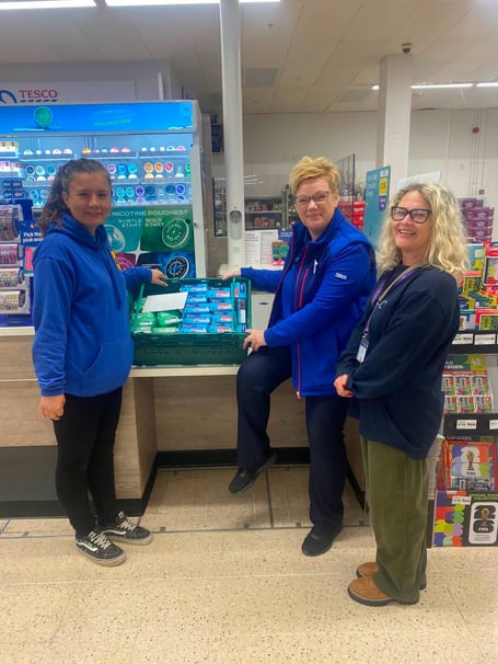 Tenby Project volunteer Lauren Smith and Emily Hughes from Legacy in the Community went to Tesco in Pembroke Dock to meet with the store’s Community Champion Gill Elliott to collect a hamper of period products for the WCs in Augustus Place Community Hall
