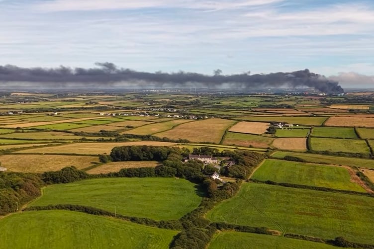 Drone image capturing the cloud of black smoke at Impala Terminal fire