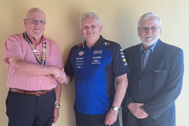 President David Thomas welcomes guest Speaker Owen Jones to the club. Also in the picture is club member Patrick Jones, who is Owen’s father.